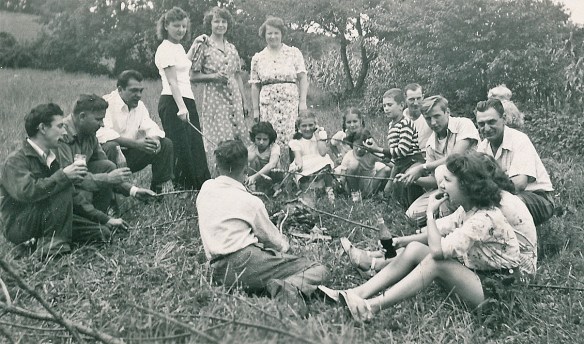 Aunts, uncles, cousins. My Mother is the woman standing on the right in the back. My Dad is the man seated facing forward on the right.
