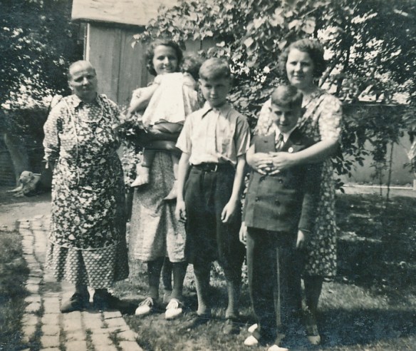 My mother (right) with her mother (left) and sister. The children are my two brothers and one of my cousins.