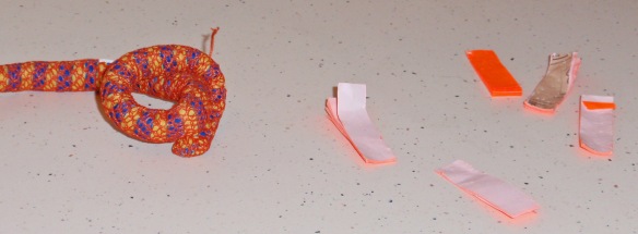 On the left is a "paid for" toy that was pawed once. On the right is that once was a pack of post-it tags.